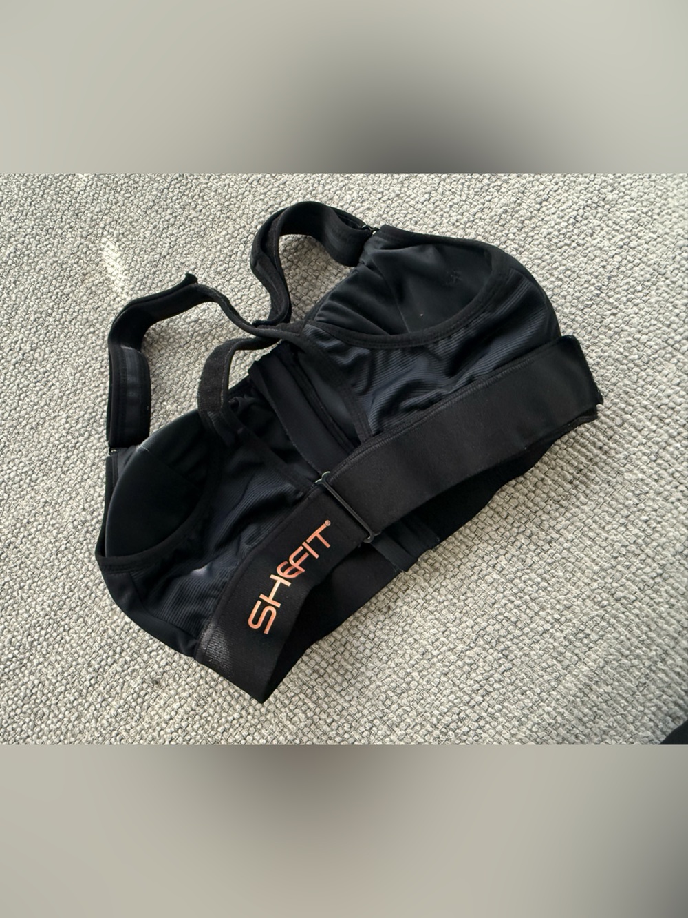 SHEFIT Black Sports Bra with Peach Logo Print